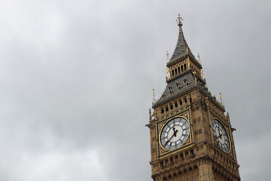 Close-up of Big Ben's clock tower against a cloudy sky