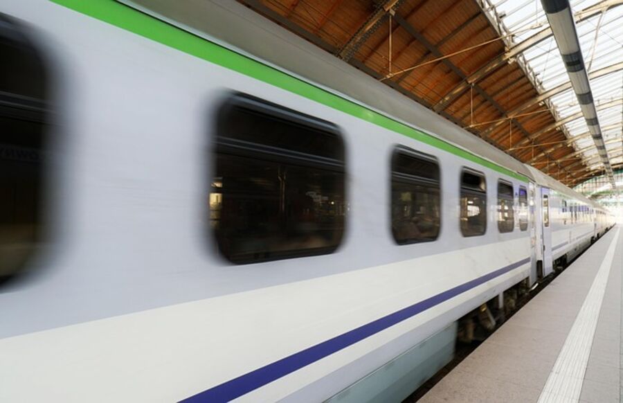 Intercity train departing from a UK station platform